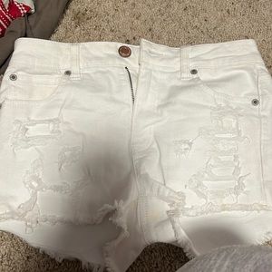 White patched ripped american eagle jean shorts